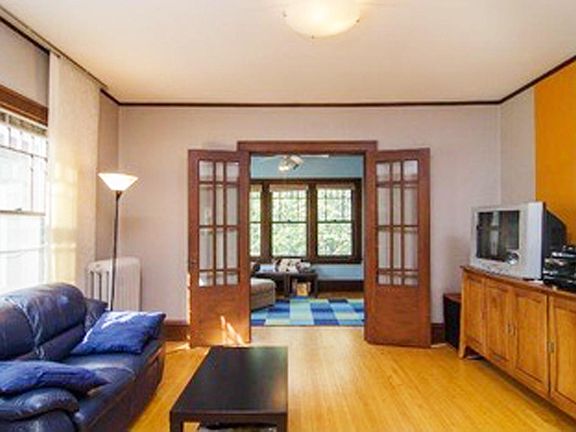BIG, SUNNY LIVING ROOM WITH FRENCH DOORS TO ADJACENT SUNROOM/OFFICE/ETC. STYLE IT YOUR WAY.