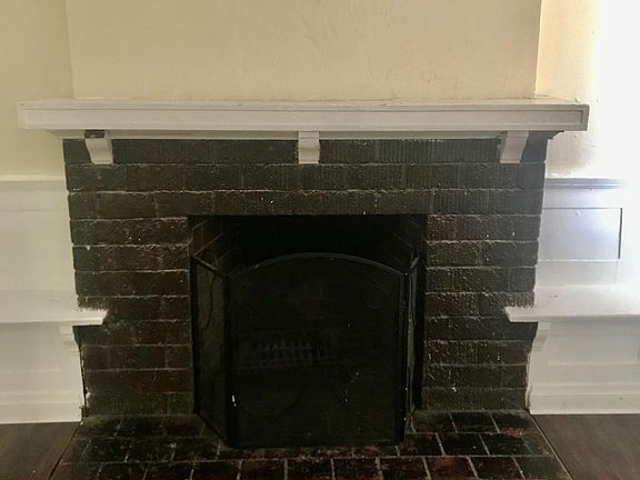 Functional fireplace between hardwood benches
