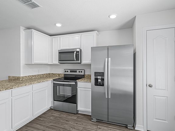 The kitchen comes chef ready with stainless steel appliances