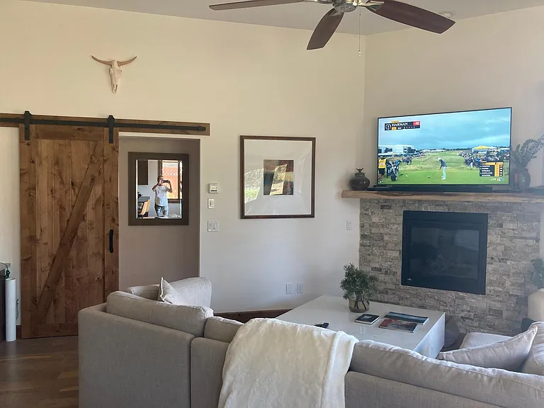 Living room and hall way to master bed and bath