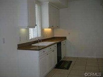 Kitchen with granite counters and tile floor