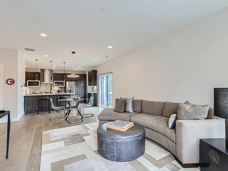 Open floor plan with kitchen, dining and living space