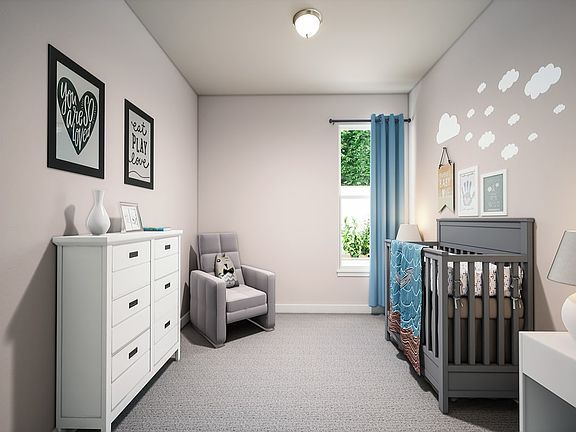 A cozy and well-designed nursery with a white dresser, a gray crib, and framed artwork on the walls,