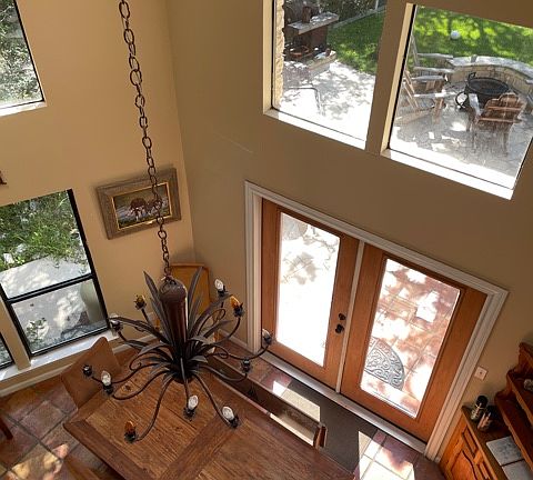 looking down from the upstairs loft to dining room