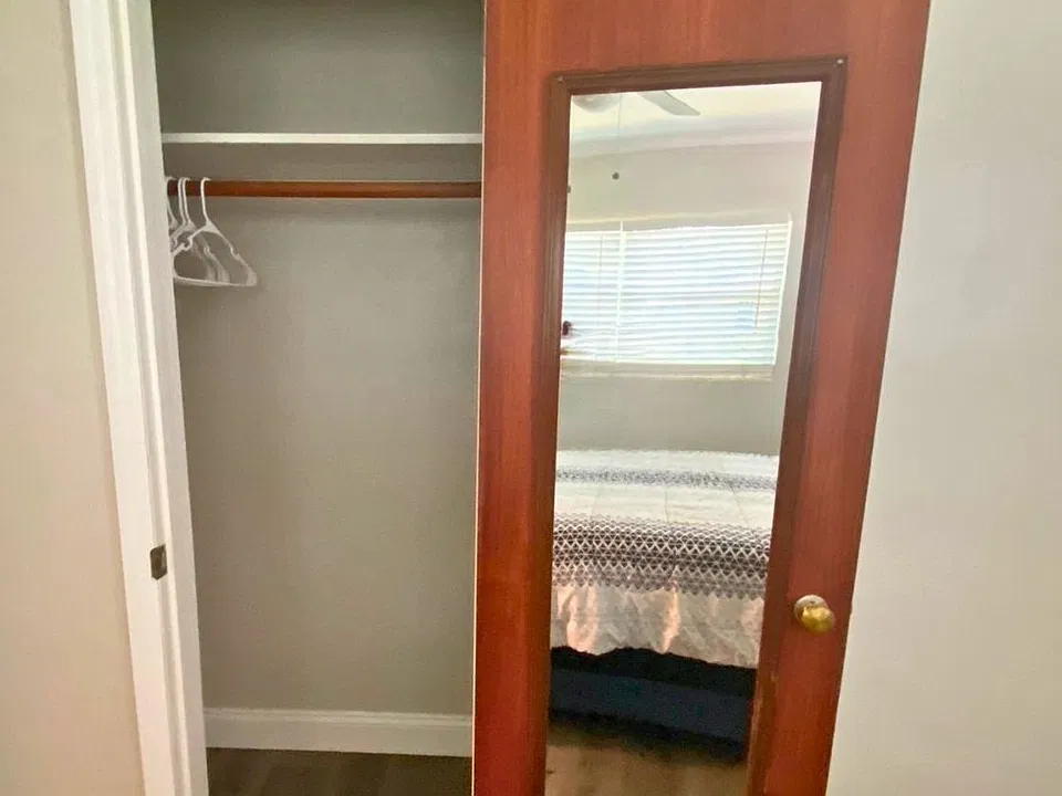 Bedroom with a spacious closet and mirror for easy storage and getting ready. Lakeland, FL