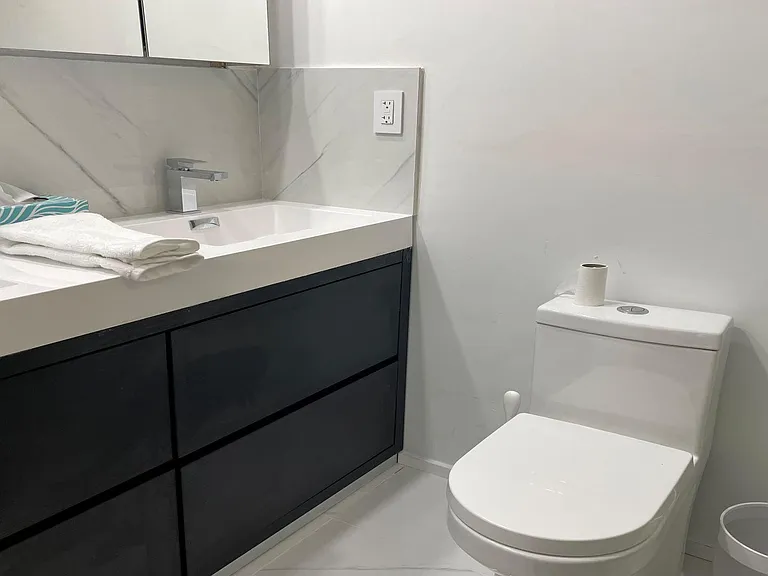 Modern bathrooms with double sinks.