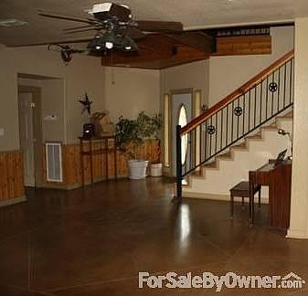 Living room
						:
						Gleaming stained concrete floors throughout the downstairs. Custom stair rails
