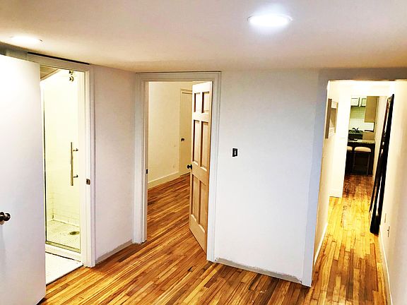 Looking out from the corner of the bedroom. Left to right: bathroom, door to main space, hallway to walkin closet