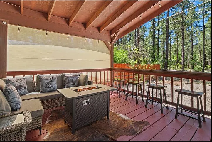 Outdoor Fire place with a lot of seating to enjoy the Home day and night.