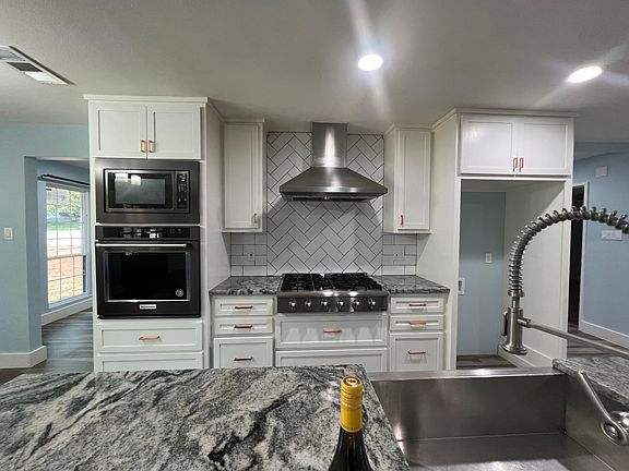 beautiful cabinets with kitchen aid, elica and thor appliances