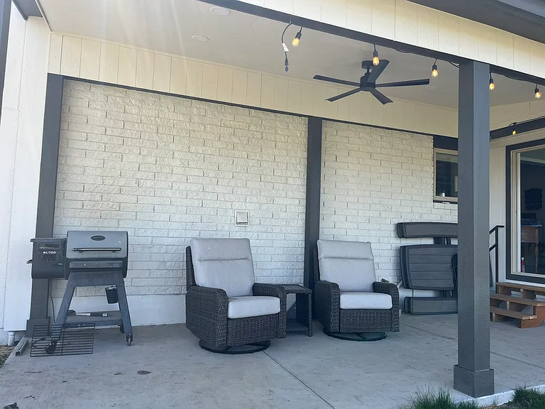 Patio with smoker, rocking recliners, and hot tub to soak in the views and the stars
