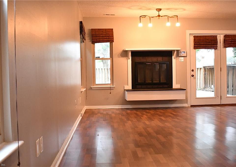 Gorgeous Brazilian cherry flooring in this open concept living area will make your dreams come true.  Enjoy chilly winter nights by your wood burning fireplace.