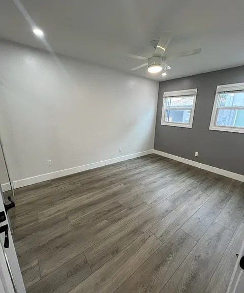 3rd bedroom with multiple windows and large closet