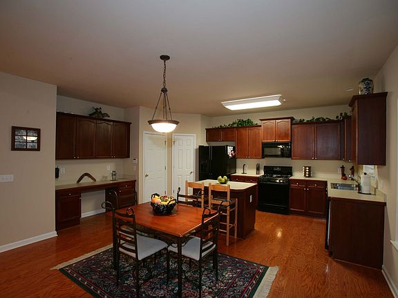 Gourmet kitchen with large island and built-in desk area