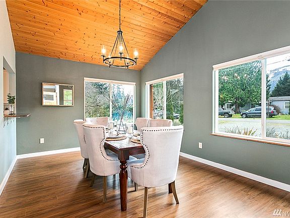 As you enter into the home you are greeted by a private dining space. This is located at the front entry of the home. 