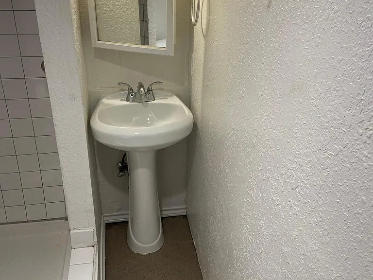 Bathroom looking right to left photo #1.