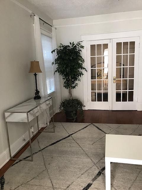 French Doors lead to Bedroom with Queen Bed
