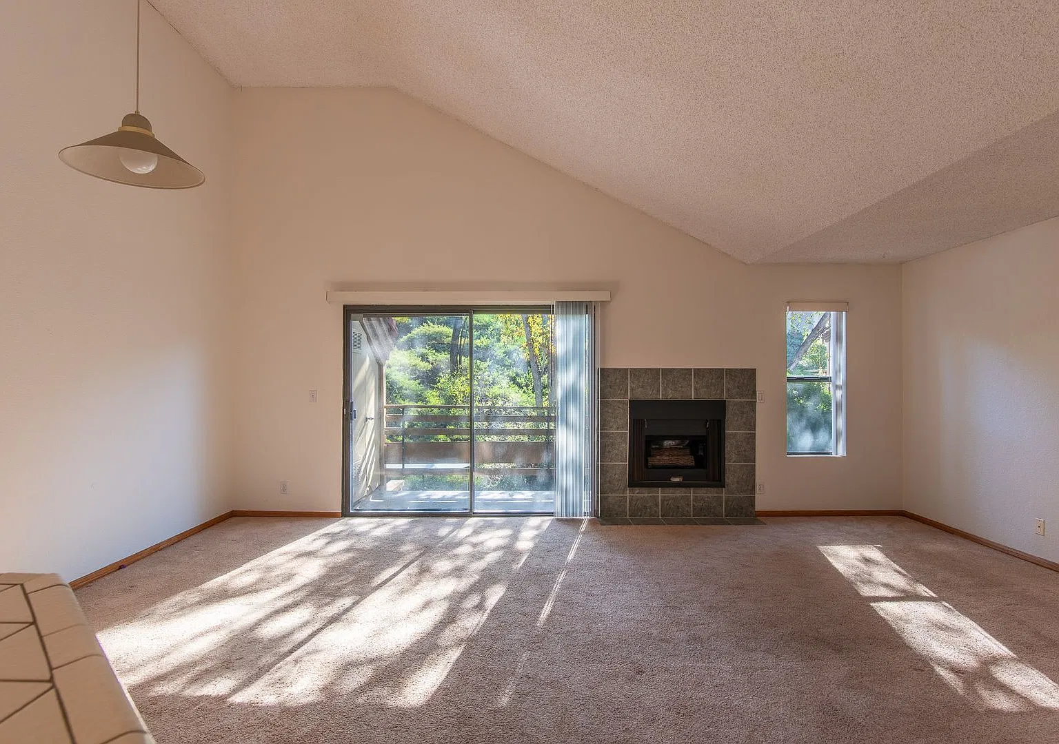 Top-Floor Living: Vaulted Ceilings, Balcony, A/C & Community Pool — Photo 3
