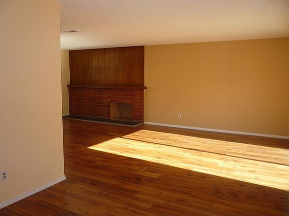 Wood floors and a brick faced fireplace lend to the charm.