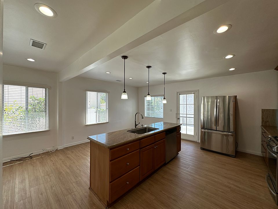 Dining area and kitchen bathed in natural light.