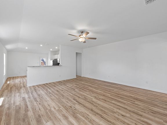 Open layout with a large living room that the kitchen overlooks