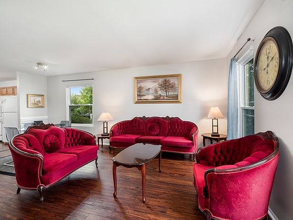 Spacious living room offers plenty of room for additional sitting area or office space.