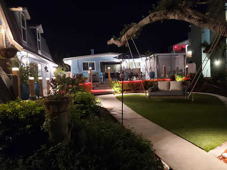BEAUTIFUL ILLUMINATION AT NIGHT-TIME LEADING BACK TO THE HOUSES