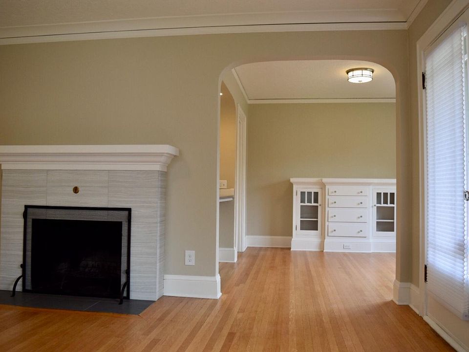 Living Room flows into Dining Room with Original Built-In Cabinetry