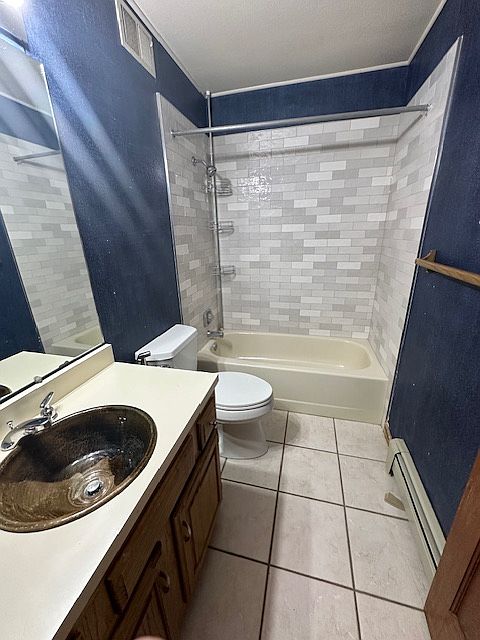 Bathroom with new Spanish tile, ceramic sink