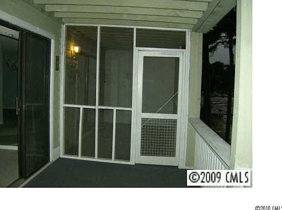 Screened porch opens to master bedroom and deck.