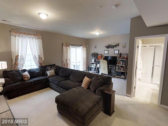 First floor living area with full bathroom and backyard acce