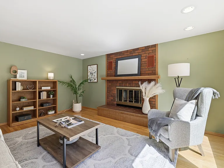 Cozy family room with brick fireplace and built-in shelving