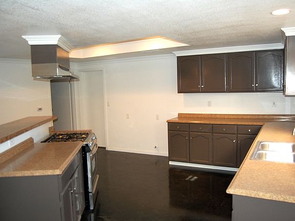 Large kitchen with skylight, loads of cabinets and counter-t