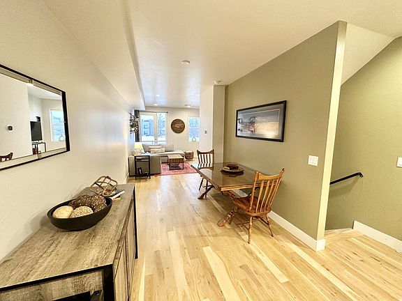 View of the dining area and living room from the kitchen. Great for hosting!