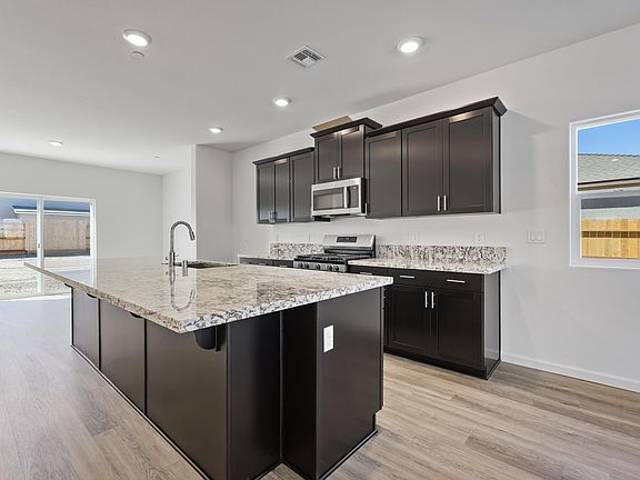 Kitchen with deep-stained cabinetry