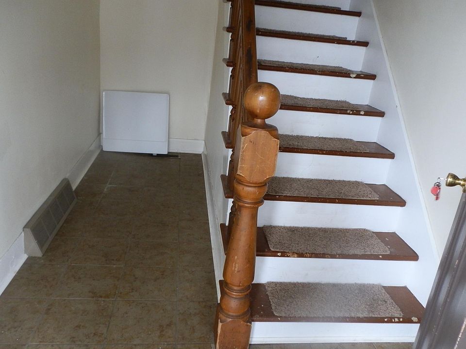 private entry, steps to upper floor.... private porch....little garden in front of entry.