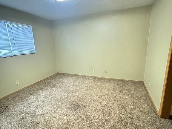 "Spacious bedrooms with large windows that fill the rooms with natural light, creating a warm and inviting atmosphere."