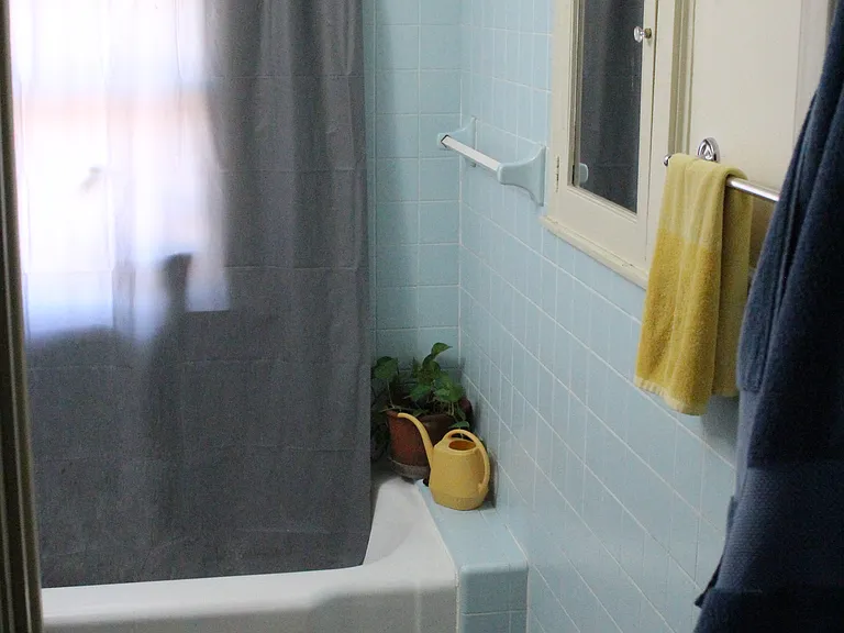 Bathroom with new tile floors installed in 2025.