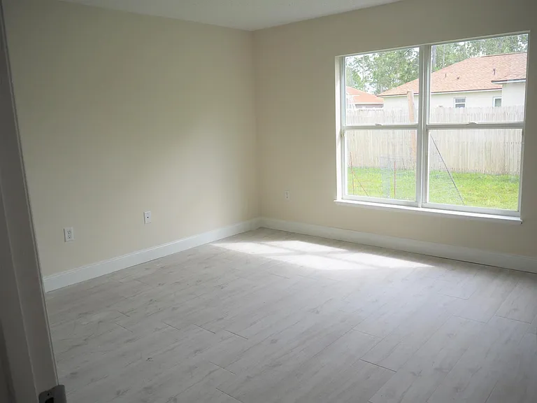 Bright sunny room with new tile floor could be a formal living room, study/office or first floor bedroom ( half bath on first floor).