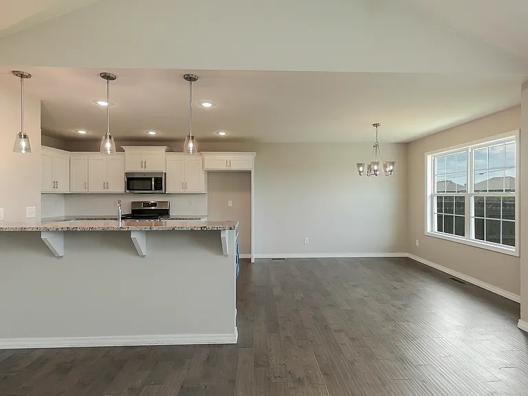 large window off of kitchen nook