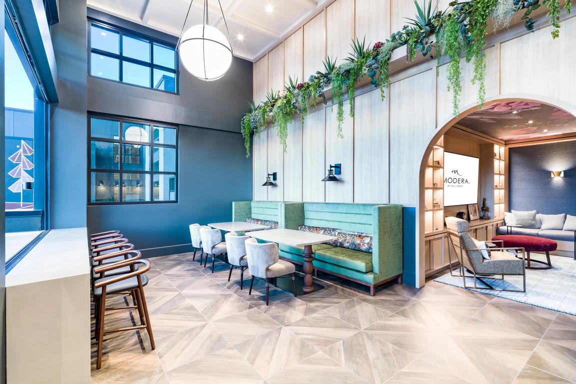 Light-filled gathering spaces at Modera University Park, designed for connection and comfort just minutes from University Park's local dining and culture.