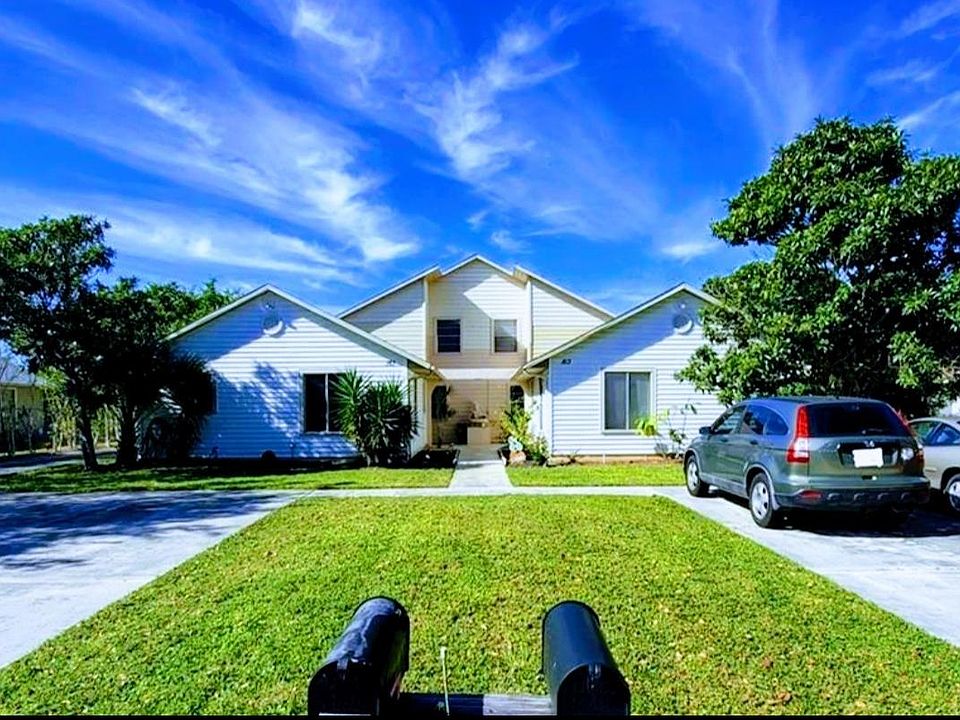 Front of the property with huge double wide driveway for 4+cars