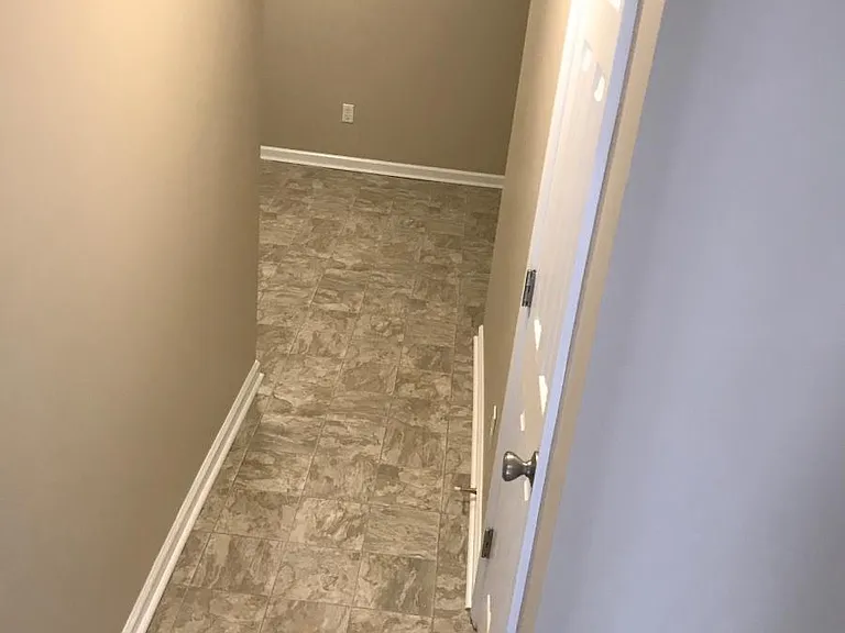 Hall to Laundry room. splits and has plenty of room for storage shelves etc.