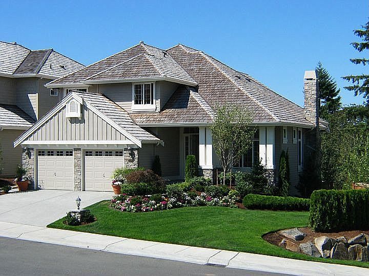 John F. Buchan 2 story home w/ finished daylight basement and a 3 car garage!