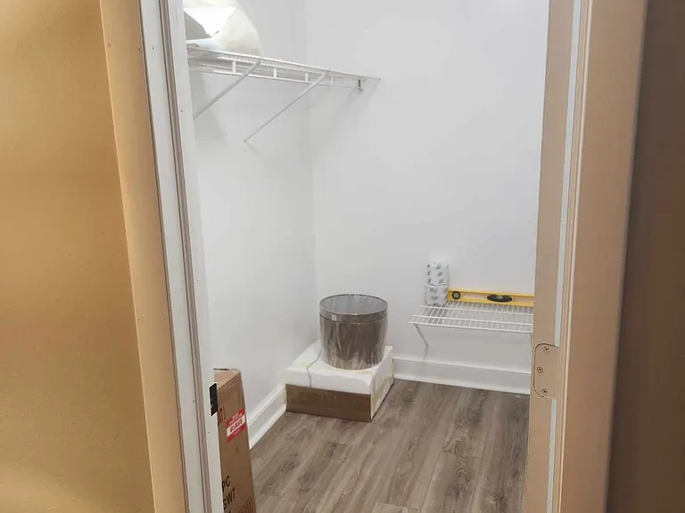 Walk in closet in primary bedroom