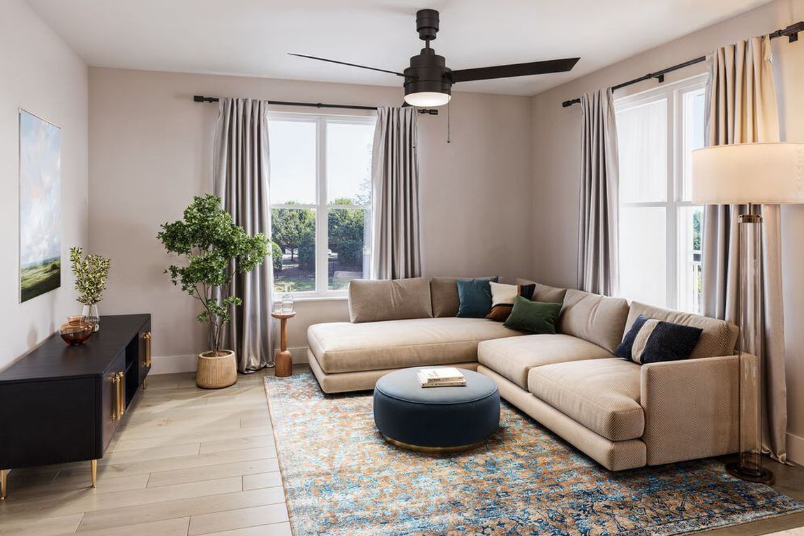 Bedroom with hard-surface vinyl plank flooring and ceiling fan (Rendering)