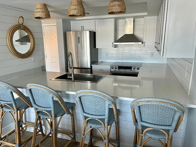 Upgraded kitchen with stainless appliances and breakfast bar.