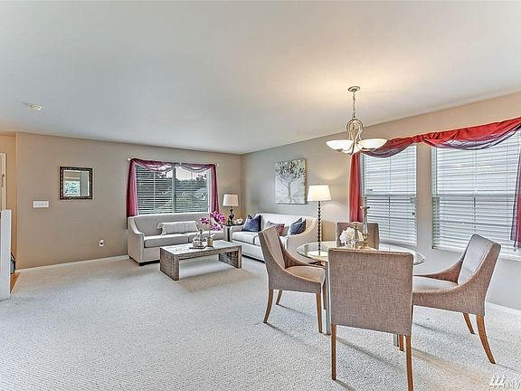 The open concept living and dining room will have you dreaming of dinner parties and holidays