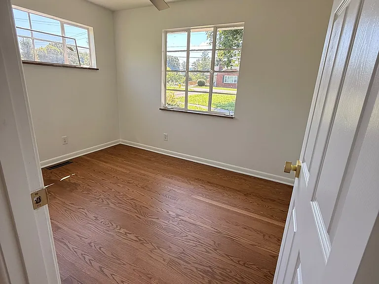 Newly refinished solid hardwood floors throughout all 3 bedrooms, main living area and dining room.