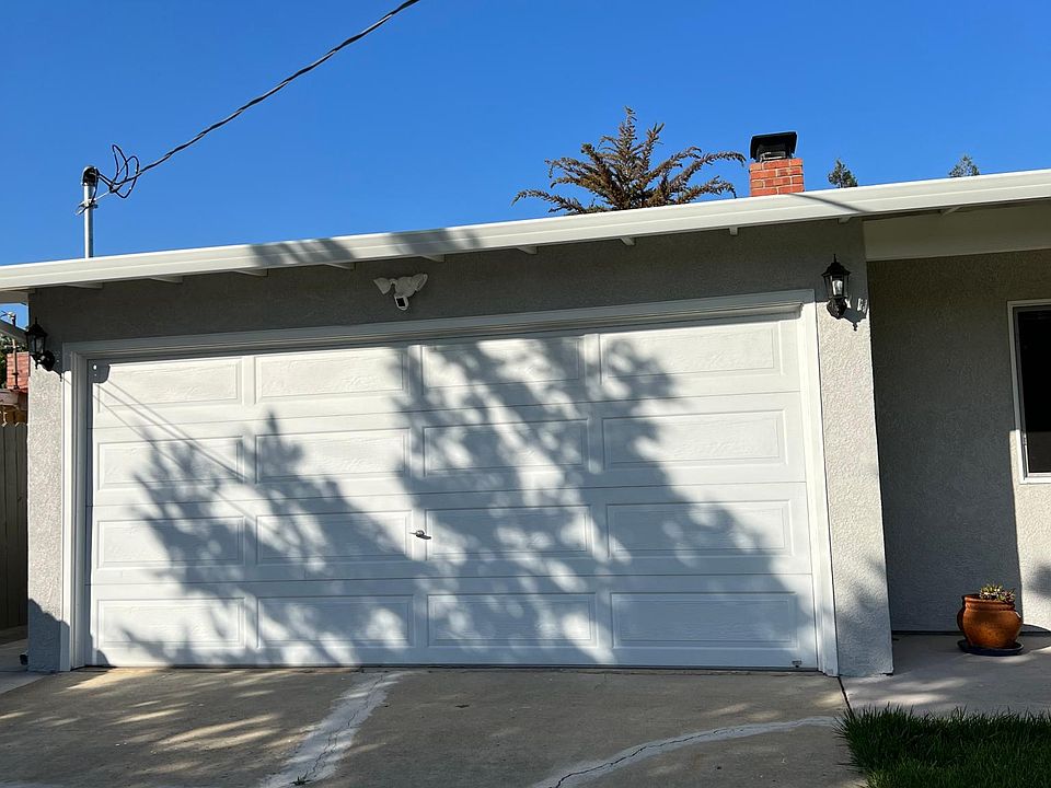 Two car garage could be a big storage room with long driveway can park more than two cars
